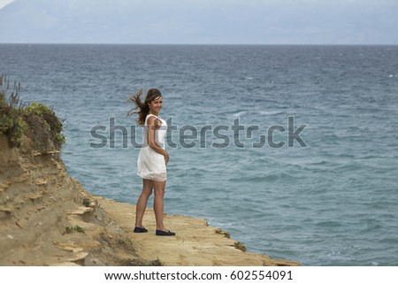 Young girl enjoys a summer into the sea