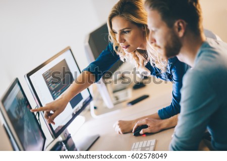 Programmer working in a software developing company office Royalty-Free Stock Photo #602578049
