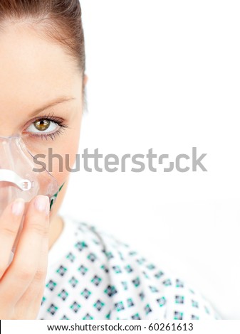 Close-upf of ill woman with a mask looking at the camera against a white background