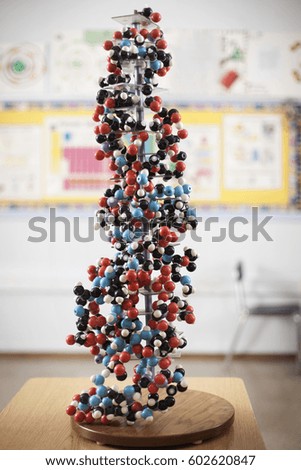 A tower of atoms bonded together in a scientific model in a classroom,