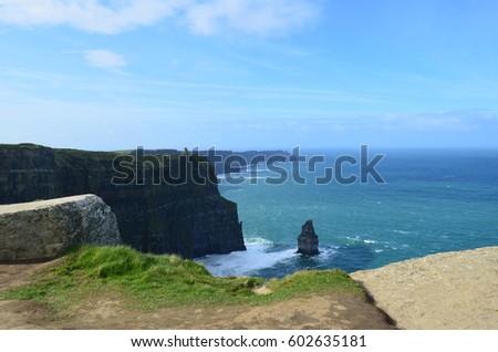 Ireland's needle rock formation with blue skies on the Cliff's of Moher.