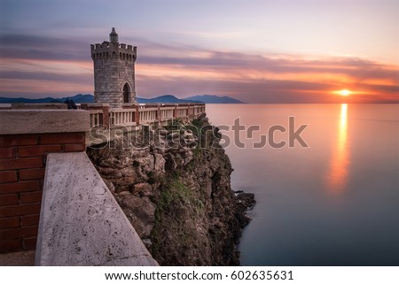 Sunset over lighthouse in Tuscany