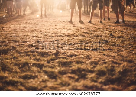 people standing in front of shining light at night Royalty-Free Stock Photo #602678777