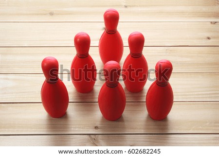 Bowling Pins on Wooden Background