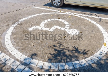 Disabled parking sign, Disabled symbol on parking lot