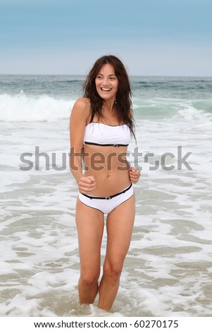 Woman in bath suit at the beach