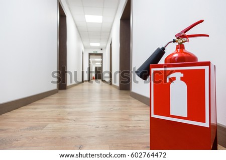 Fire extinguisher in business center corridor