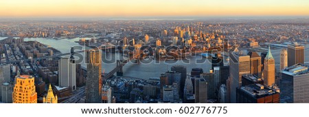 Manhattan downtown sunset rooftop panorama view with urban skyscrapers in New York City