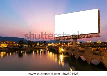 blank billboard on urban and lake in the twilight - can advertisement for display or montage product or business