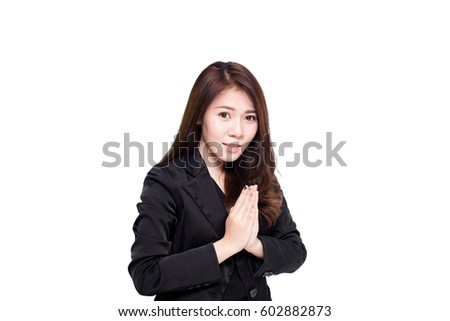 Asian business woman stand and pay to respect on white background