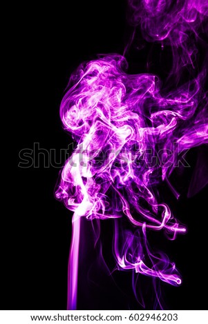 Purple smoke on a black background
