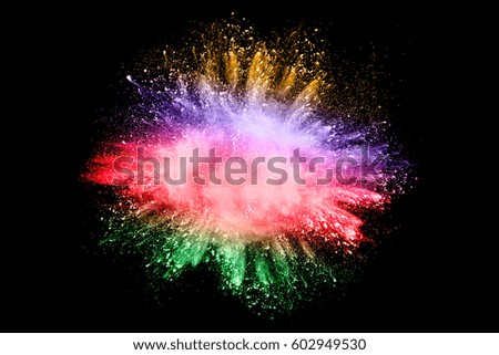 Abstract bright colorful powder on black background.