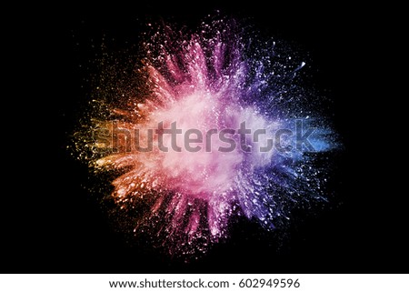 Abstract bright colorful powder on black background.