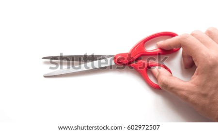 Scissors red Isolated on white background with hand