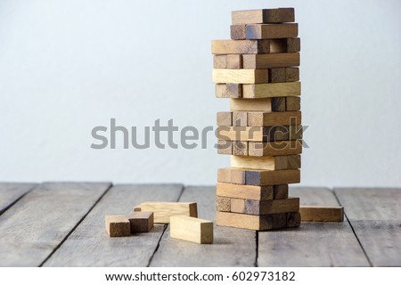 brown  wood building block tower  Royalty-Free Stock Photo #602973182