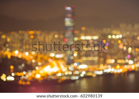 Aerial view blurred bokeh light Hong Kong city downtown, abstract background
