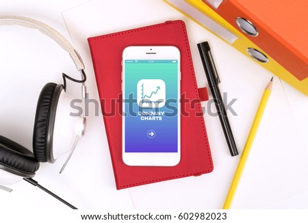 Company Charts icon technology concept on smart mobile phone for presentation. Interface and application design with phone on white table. Top view office objects isolated.