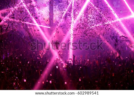 Silhouette crowd people concert show. Celebrate new year party. Blur for background abstract festival Bangkok Thailand.