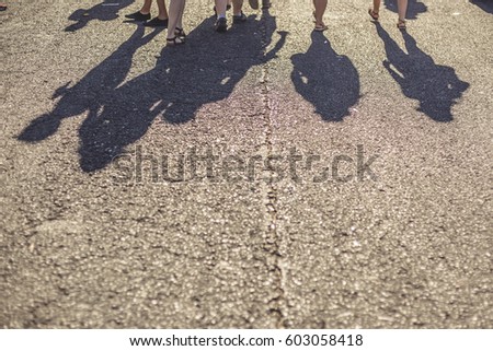shadows of people on a sunny day  Royalty-Free Stock Photo #603058418