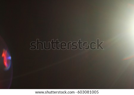 Abstract background - light flashes and bokeh. Sun rays. Shadows. Lens flare on a black background for use as a texture layer in your project. Add as "Lighten" Layer to add light flashes to any image.