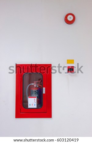 Extinguisher and alarm set on the wall