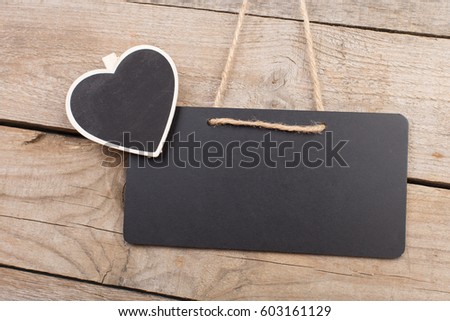 Black notice boards with copy space on wooden background