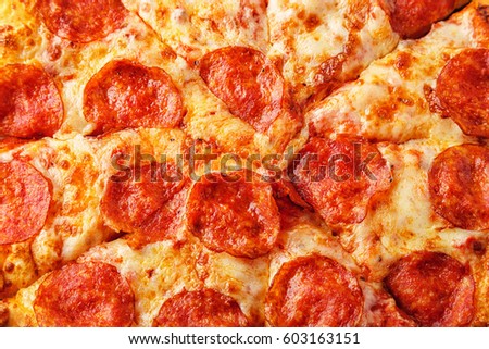 Pepperoni pizza with mozzarella cheese and tomato sauce, selective focus.