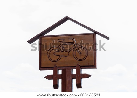 Wooden bicycle road sign