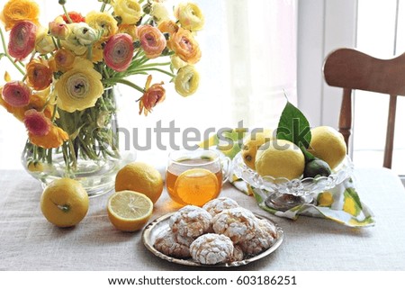 Lemon cookies with white chocolate and ranunculus bouquet of flowers