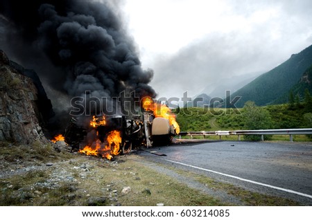 Burning tank car road accident on the track selective focus