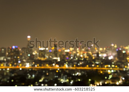 Blurred sky night city background circle round light.blur downtown construction structure backdrop.blurry urban place