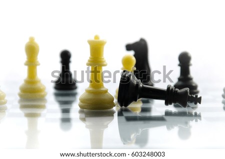 The black Chess Queen is the winner of the chess battle Concept: challenge, one against all , team , success , sport, victory