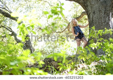Girl taking pictures in the outdoors