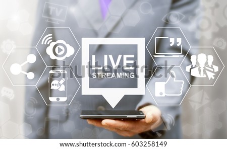 Live streaming social media web network concept. Man offers smart phone with bubble live streaming icon on virtual screen. Broadcast online technology stream video and music. Internet marketing.