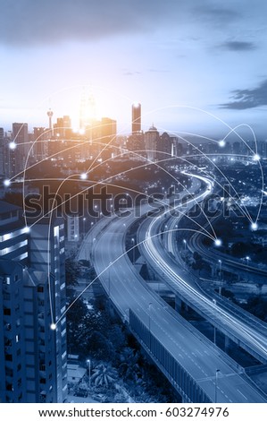 Blue tone Kuala Lumpur cityscape and network connection concept. Sunbeam effect. Royalty-Free Stock Photo #603274976