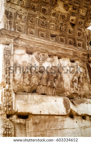 Arch of Titus at Roman Forum, Rome, Italy. Detail with carving image of conquest of Jerusalem. It is historical landmark of Rome. Ancient art, famous relief and ornament on old stone monument. 