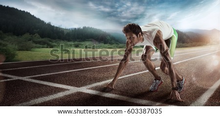 Sport backgrounds. Sprinter starting on the running track. Dramatic image. Royalty-Free Stock Photo #603387035