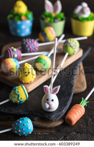 Easter decoration cake pops served on wooden background,selective focus 