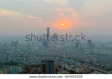 Hanoi skyline cityscape at twilight period. Air pollution in the big city. Smog over in the air.