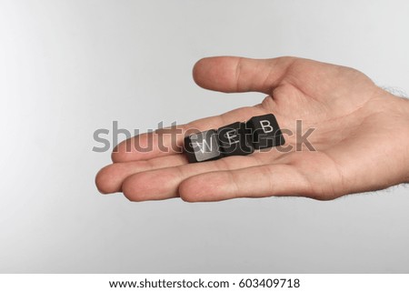 Open palm with three computer buttons with letters WEB 