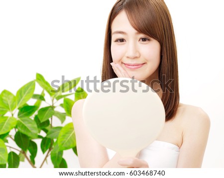Asian woman checking a skin