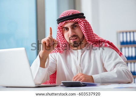 Arab businessman working on laptop computer