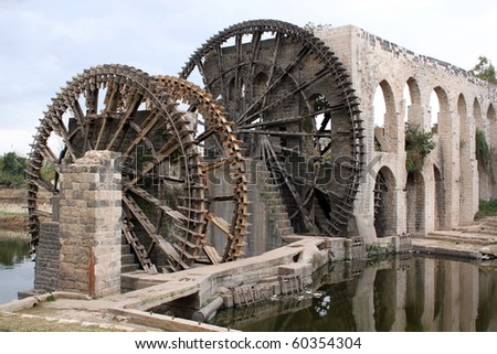 Big old noria on the river in Hama, Syria Royalty-Free Stock Photo #60354304