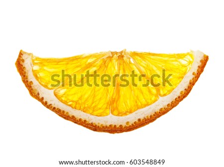 Dried slice of orange over white background Royalty-Free Stock Photo #603548849