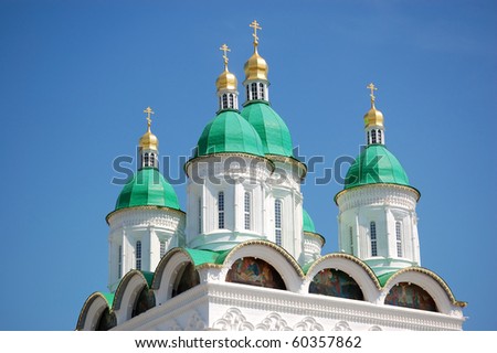 cupolas of church in Russia with blue sky as background