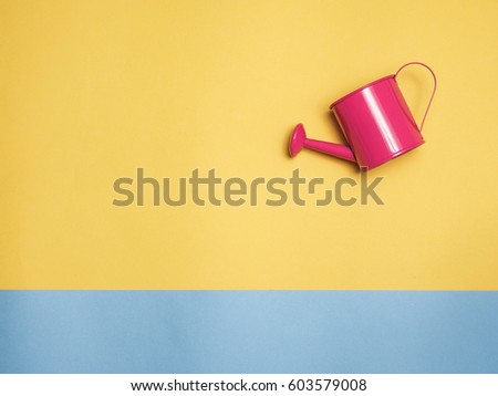 Watering can color and color background for copy space create idea for business ,something.