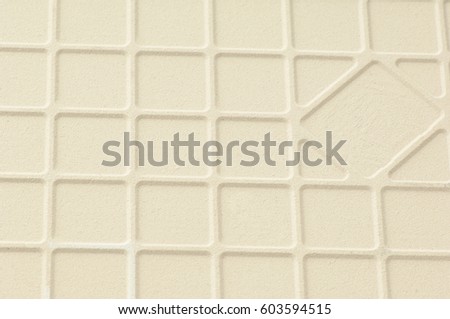 background of ceramic tiles with square veins of cream color. ridge background