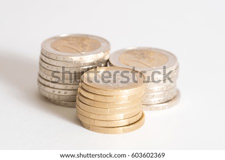 Many euro coins on white background
