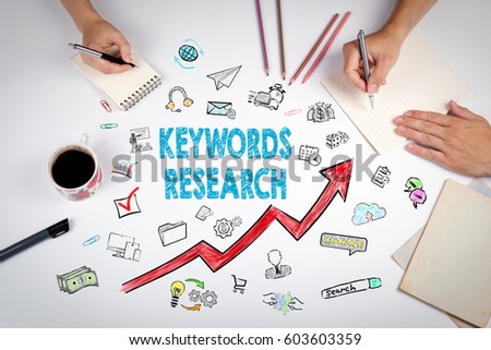 Keywords Research Business Concept. The meeting at the white office table Royalty-Free Stock Photo #603603359