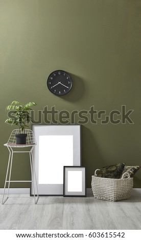 natural green wall interior concept behind empty frame with mock up 